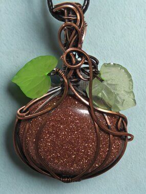 Handmade Wire Wrapped Goldstone Pumpkin pendant. Copper Wire Wrapped Crystal